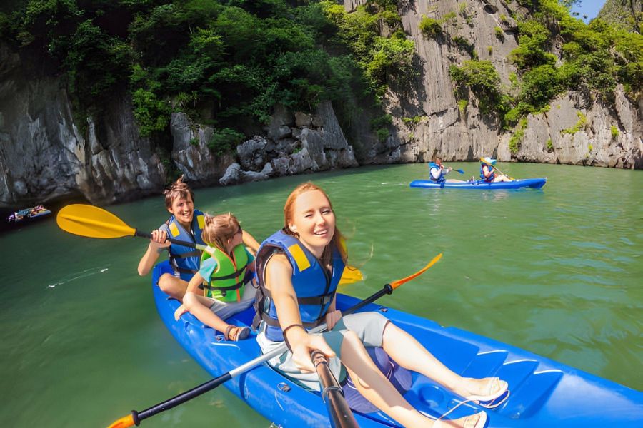 Families can enjoy kayaking together to explore mysterious caves or swim in the emerald waters