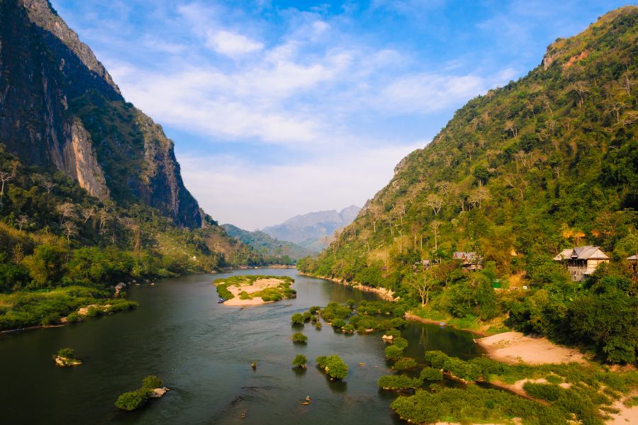 Nong Khiaw surrounded by limestone mountains and the Nam Ou River in Northern Laos