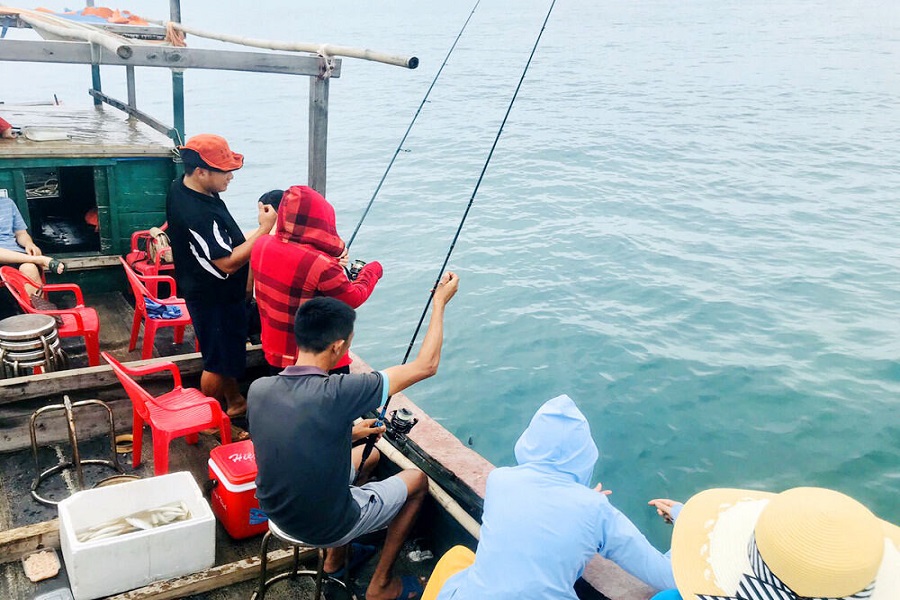 Tourists go fishing on boats at Seo Island