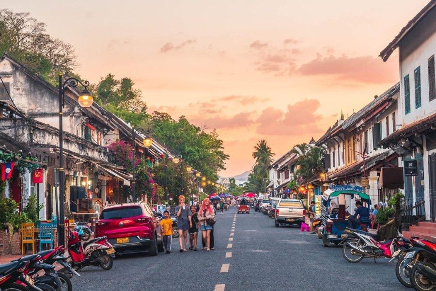 Sunset over the quiet streets of Luang Prabang, ideal for a stroll before the parade