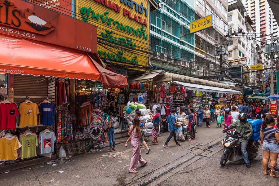 Immerse yourself in the bustling atmosphere at Pratunam Market