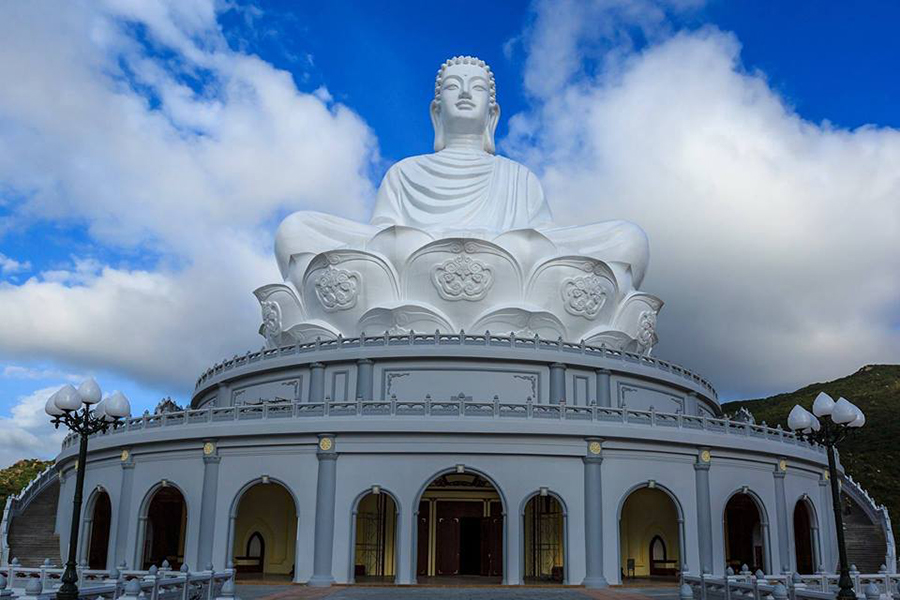 Front view of the giant white Buddha statue at Ong Nui Temple