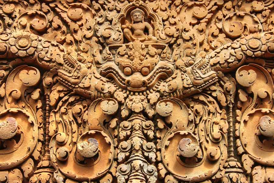 Banteay Srei is built largely of a hard red sandstone that can be carved like wood