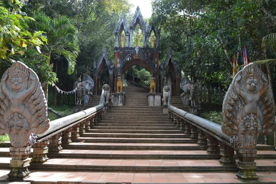 The central attraction of Preah Ang Thom is a massive, carved sandstone boulder featuring a reclining Buddha