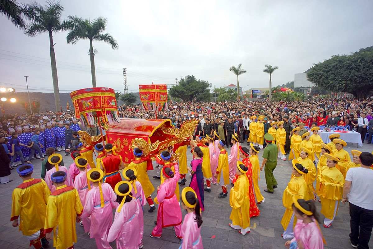 The locals wear traditional costumes while participating in the palanquin procession