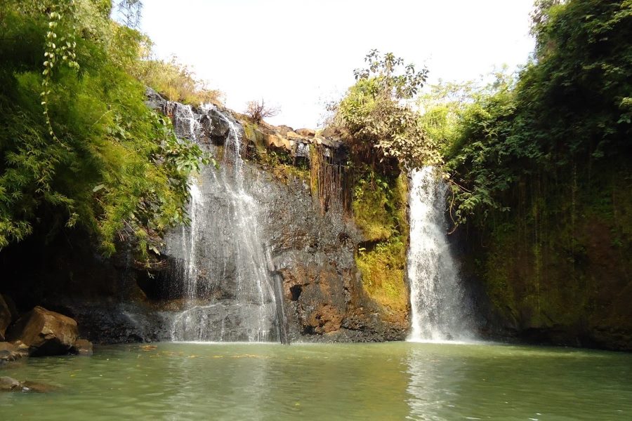 Kachang Waterfall is a captivating natural wonder surrounded by lush greenery 