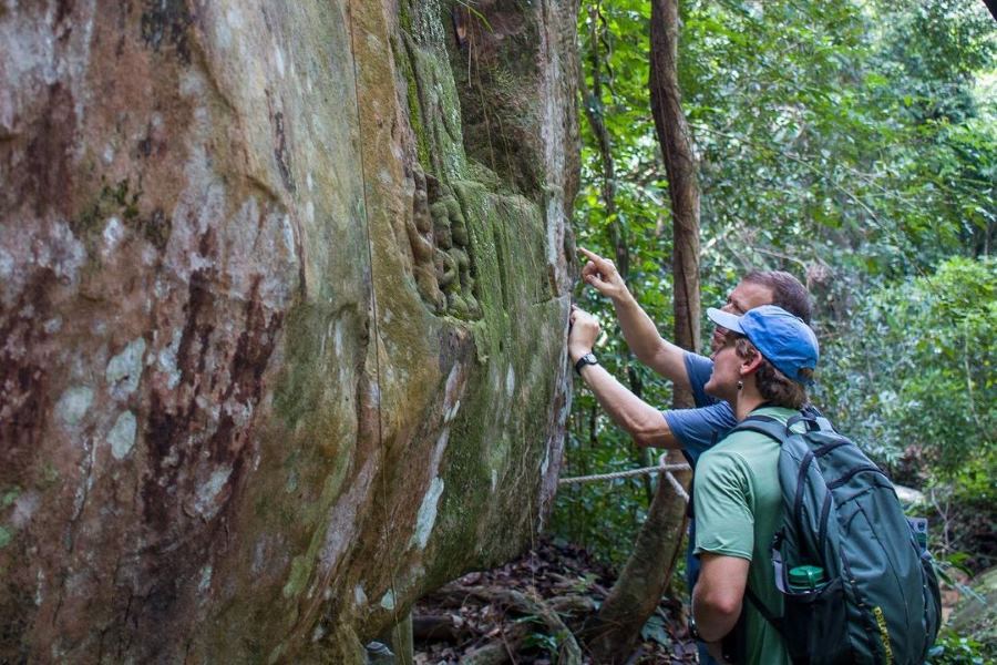 The journey to Kbal Spean involves a pleasant 45-minute to 1-hour trek through a lush forest