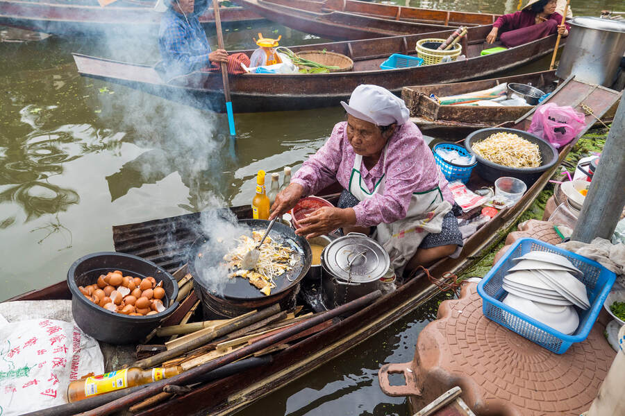 Locals sell food on boat