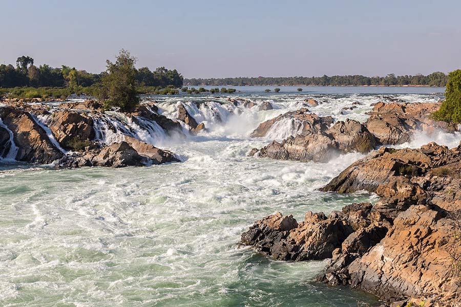 Khone Phapheng Falls, located in southern Laos near the town of Don Khong, is the largest waterfall by volume in Southeast Asia