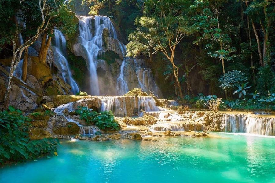 The crystal-clear waters and the chirping of birds at Kuang Si Waterfall