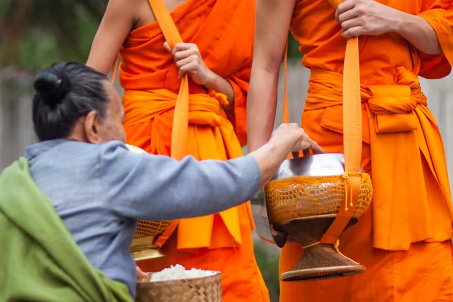 Tourists ought to act respectfully when attending the Tak Bat ceremony