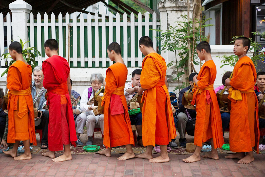 Pay respect if you decide to participate in the Tak Bat almsgiving ceremony