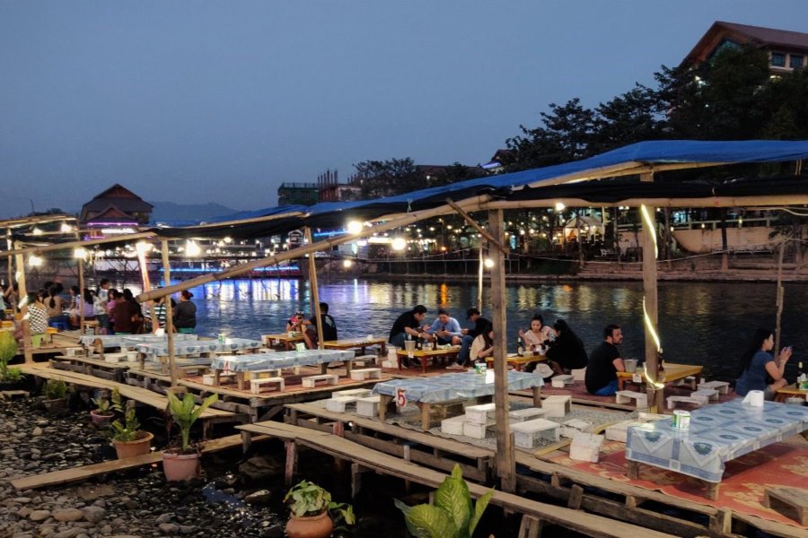 Sitting by the river with a beer and enjoying the cool air in Vang Vieng