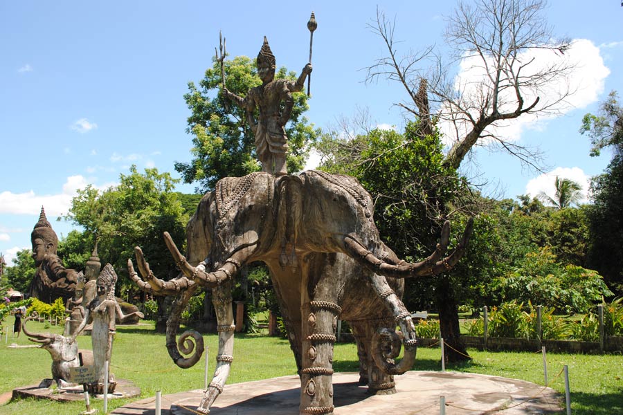 The three-headed elephant statue is a prominent and symbolic sculpture that can be found in various cultural and religious contexts, including in sculpture parks like Buddha Park