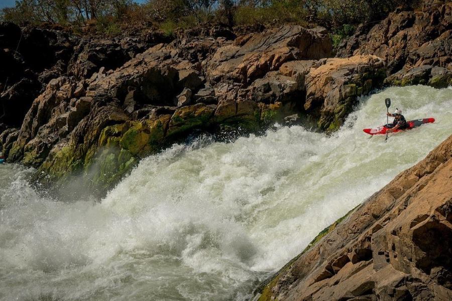 Embark on a scenic boat tour along the Mekong River to get up close to Liphi Waterfall