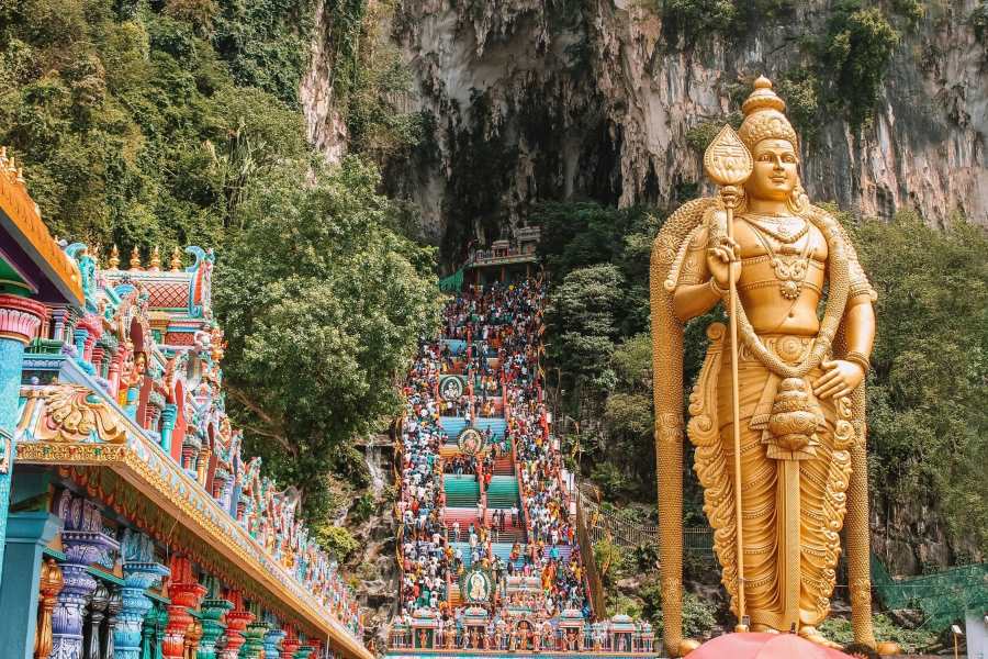 Many people climb 272 steps to reach the top of the Batu Caves temple