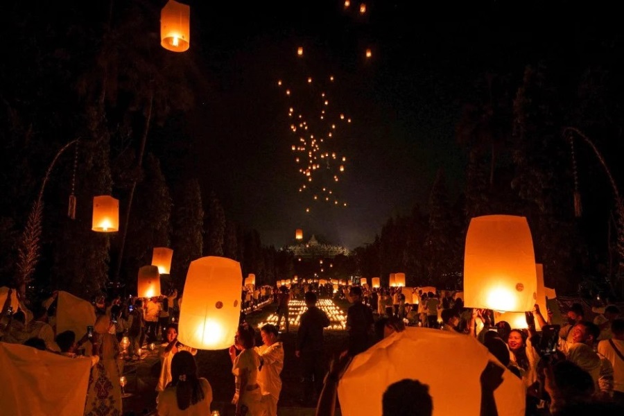 People release lanterns to wish for good luck and blessings 