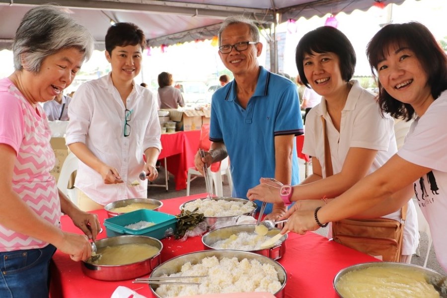 People are organizing the vegetarian meal for Vesak festival