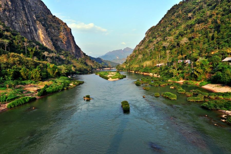 The Nam Ou River exudes a tranquil charm with its gentle flow