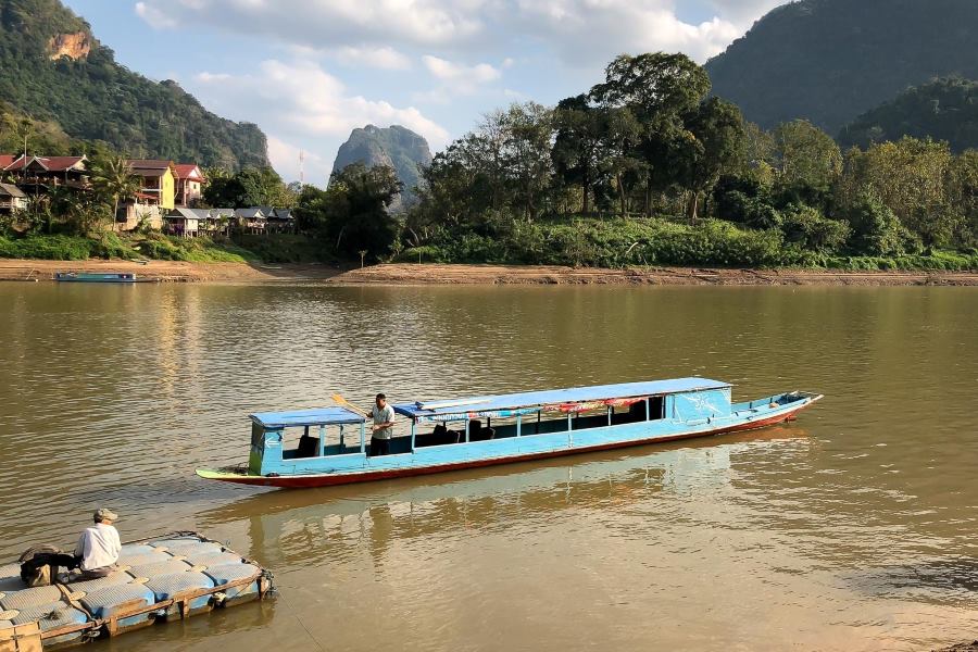 You can use tuk-tuks, a popular means of transport in Laos, or boats