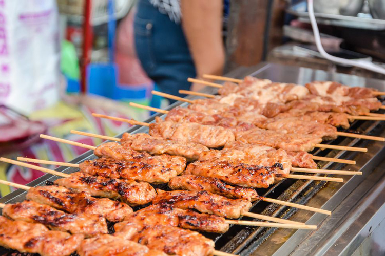 Satay consists of skewered and grilled meat, served with a flavorful sauce