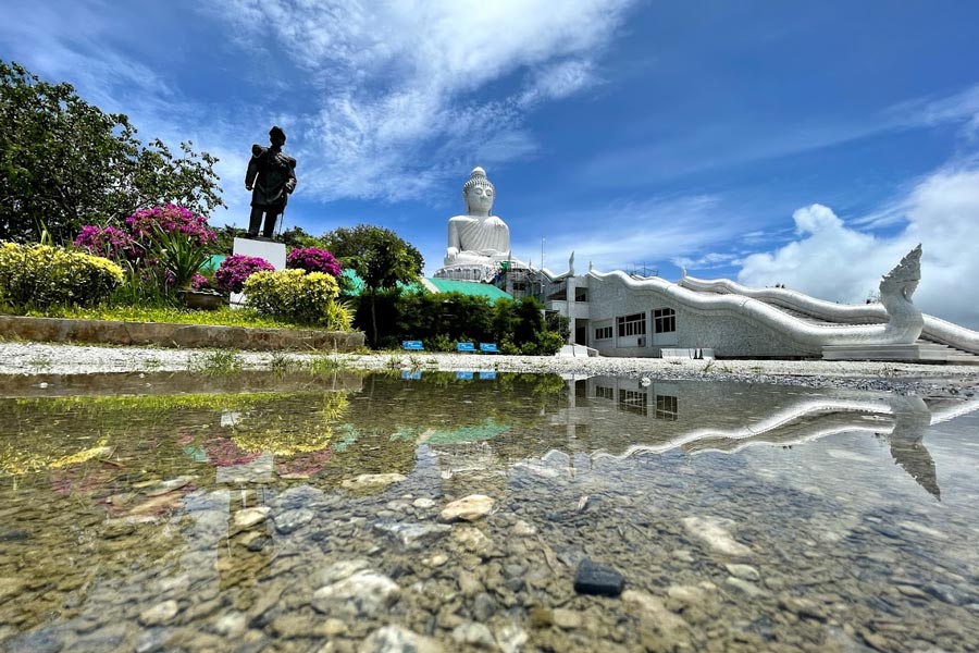 The temple grounds surrounding the Big Buddha Statue in Phuket provide a serene and spiritually charged environment for visitors