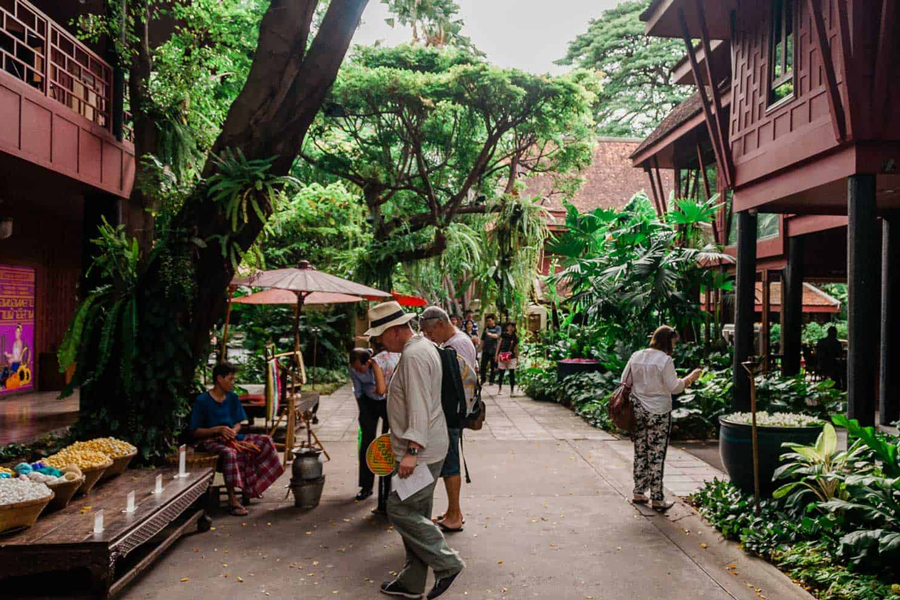 Exploring the museum and gardens at the Jim Thompson House in Bangkok offers visitors a rich and immersive experience