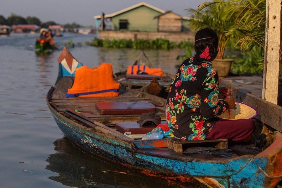 Taking a boat ride to enjoy the scenery on Tonle Sap Lake in Cambodia is a must-do activity