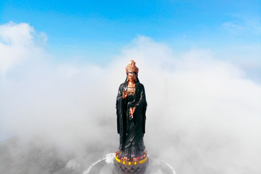 The majestic statue of Ba Tay Bo Da Son Buddha on the top of Ba Den Mountain