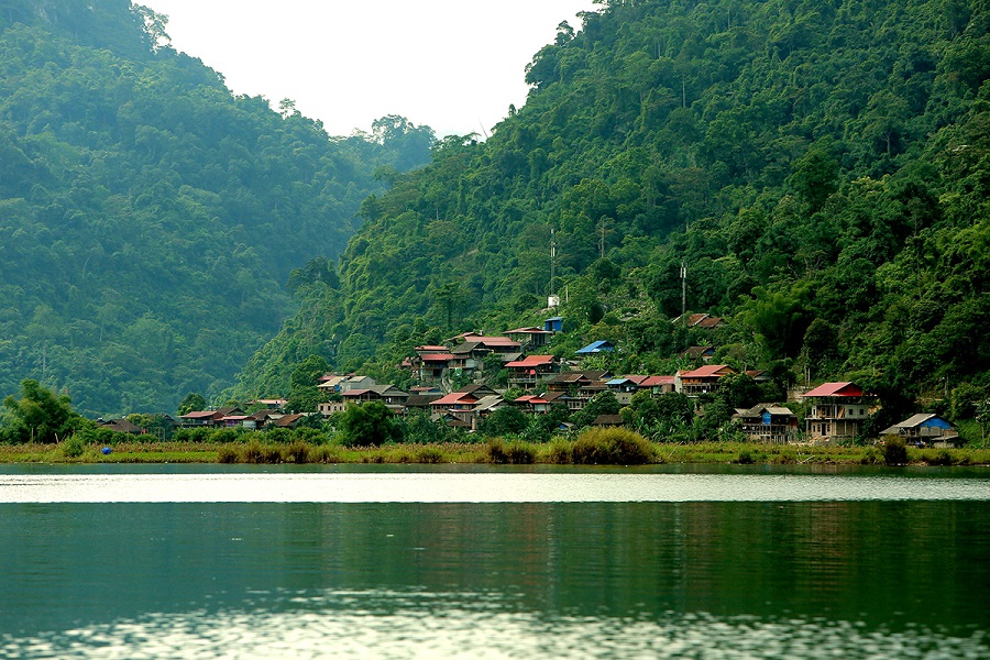 Pac Ngoi Village lies peacefully beside the calm waters of Ba Be Lake
