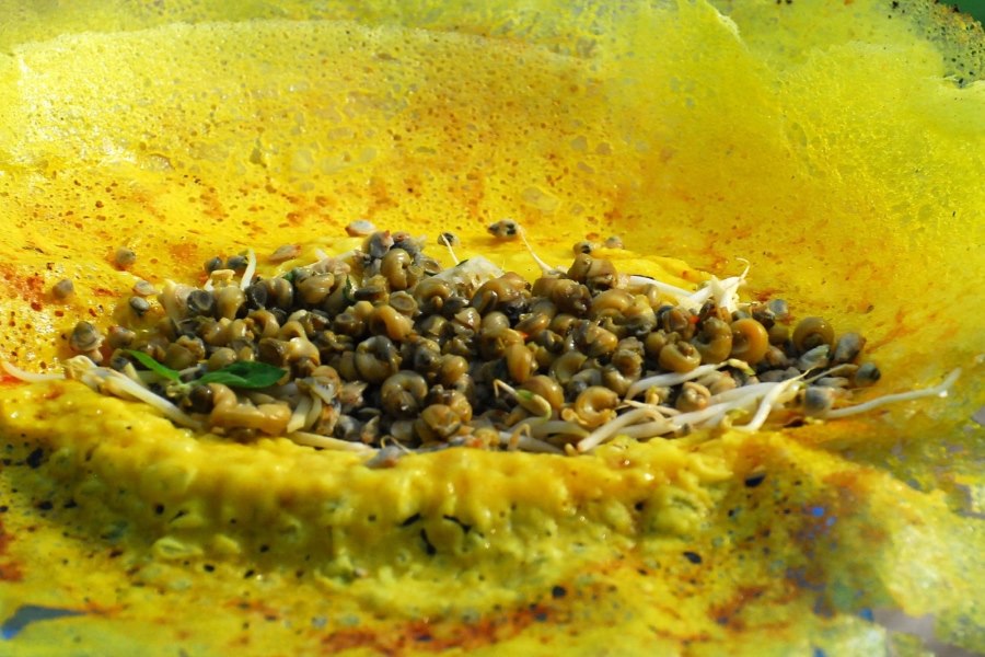 A bite of crispy pancake with flavorful toppings is truly one of life's wonders