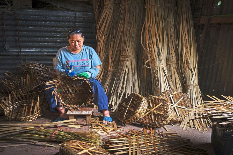 An artisan crafting a basket intended for storing fish at a factory in Teluk Intan, Perak. — Photos: MAHIZZAN FADZIL