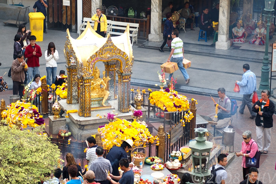 Thai people come to offer incense at the Erawan Shrine