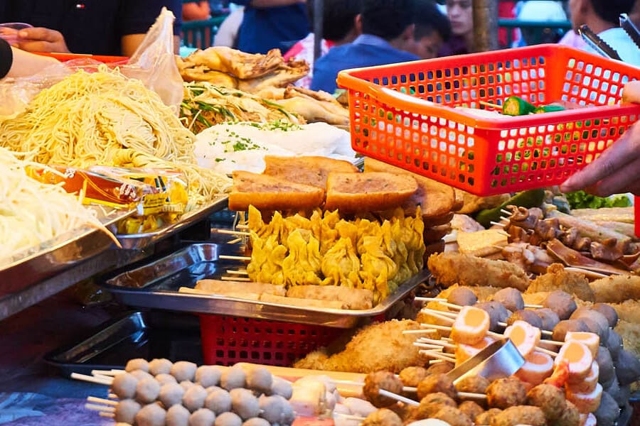 Famous Khmer food is served in picnic style at Phnom Penh night market