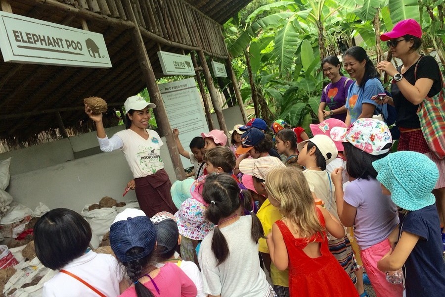 Children eagerly learn about the paper-making process in Elephant POOPOO PAPER Park