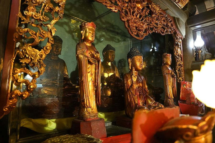 Buddha statues made of rare wood in Tam Bao Palace