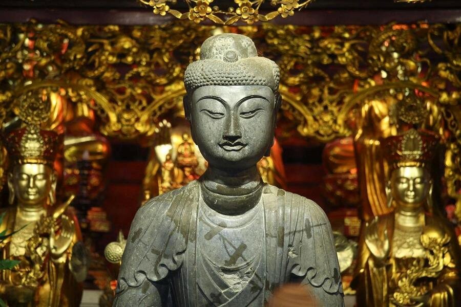 The Amitabha Buddha statue still retains its outline after thousands of years