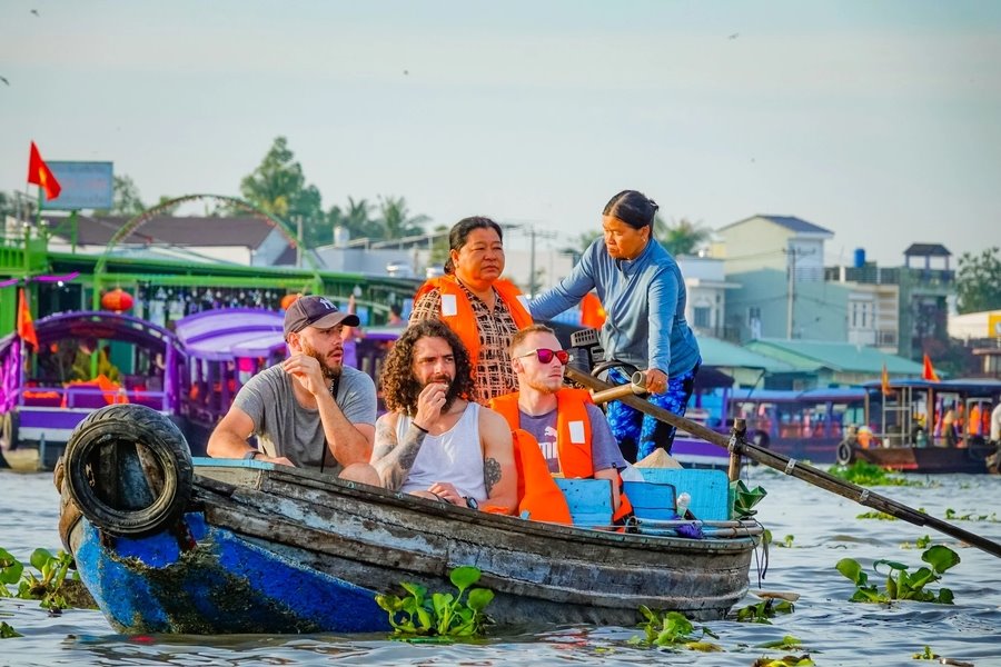 Locals always welcome visitors onto their boats. Source: Thanh Nien Newspaper