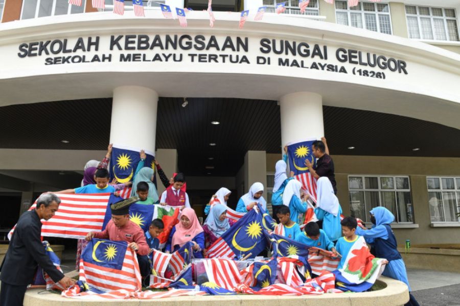 Secondary school hangs flag to celebrate Malaysia day