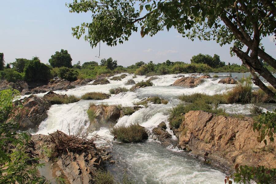 The waterfall becomes more turbulent and foamy during the rainy season