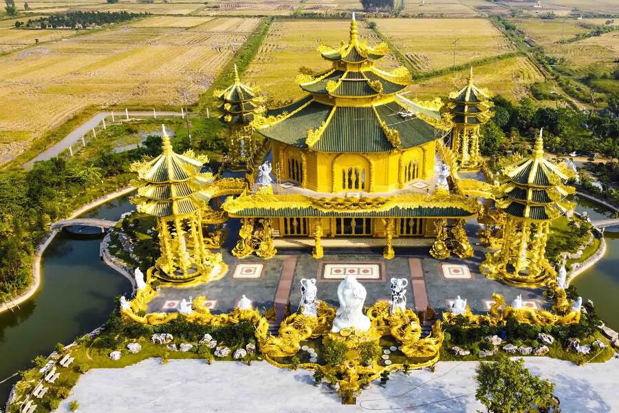 The pagoda surrounded by a lake and overlooking boundless rice fields. Photo: Collective