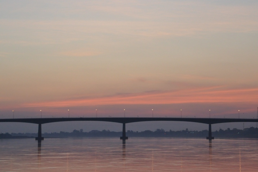 Sunset on the bridge connecting Thailand and Laos. Photo: AnnetteinBangkok