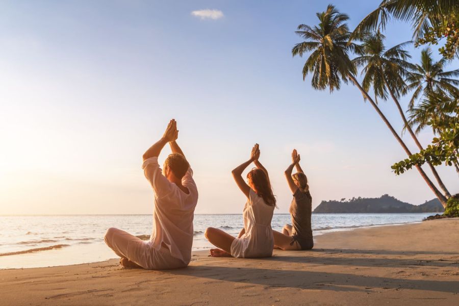 Practicing yoga by the sea.