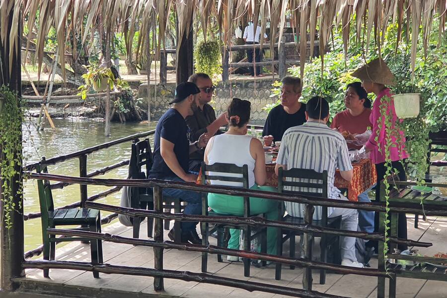 Foreign visitors enjoy local cuisine. Photo: Thanh Nien