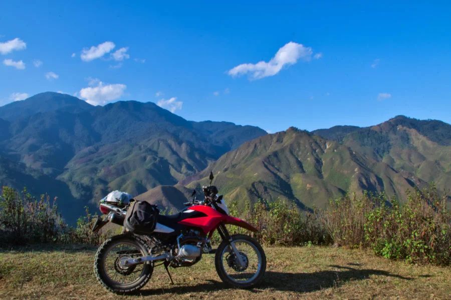 Visitors can choose to ride a motorbike to Xim Vang