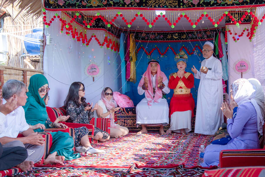 Visitors witness a reenactment of a traditional Cham wedding ceremony. Photo: An Giang Newspapers