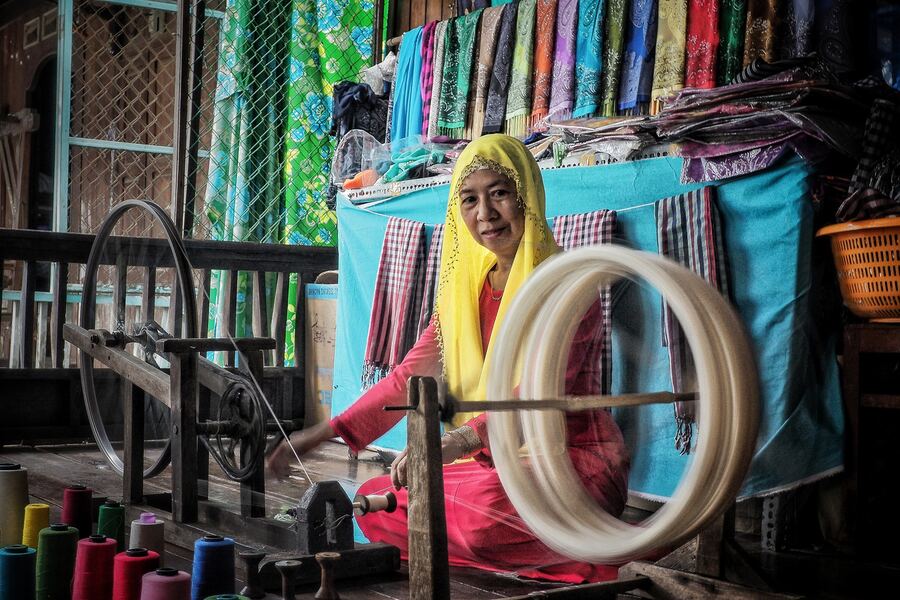 A Cham woman beside a weaving loom. Photo: Tham hiem Mekong