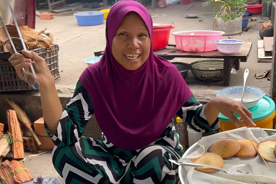 Ms. Rofiah usually sells Haco pancakes at the locals market. Photo: MIA