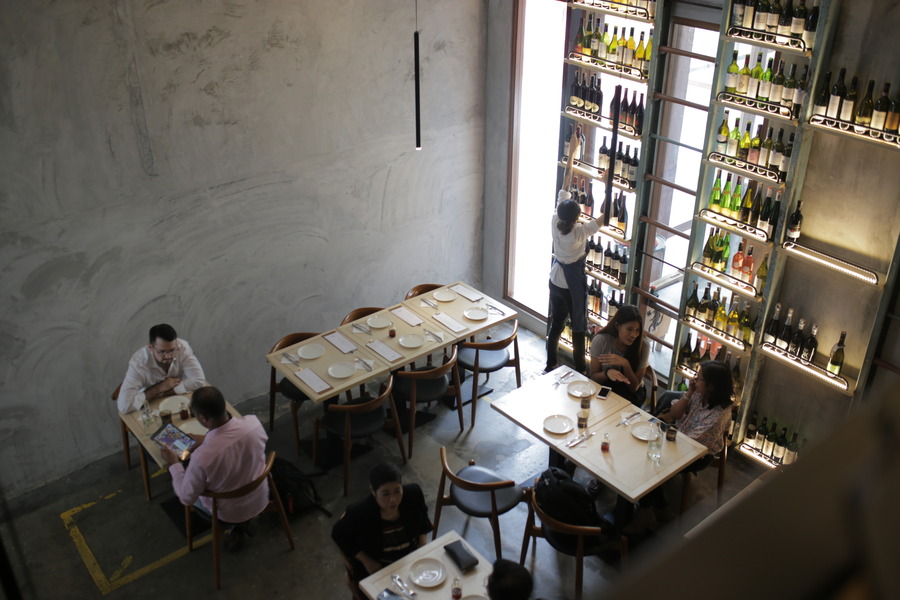 Enjoy pizza and sip on a glass of wine in a space infused with European charm