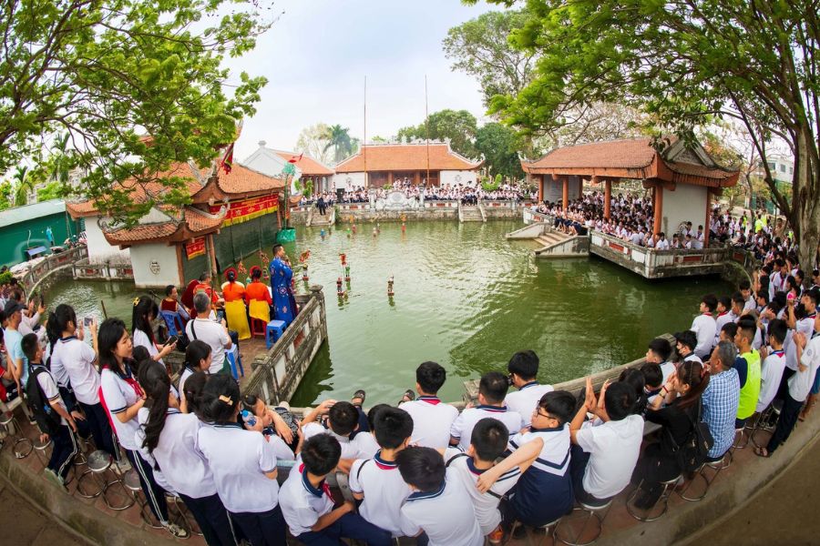 People gathered to watch water puppetry